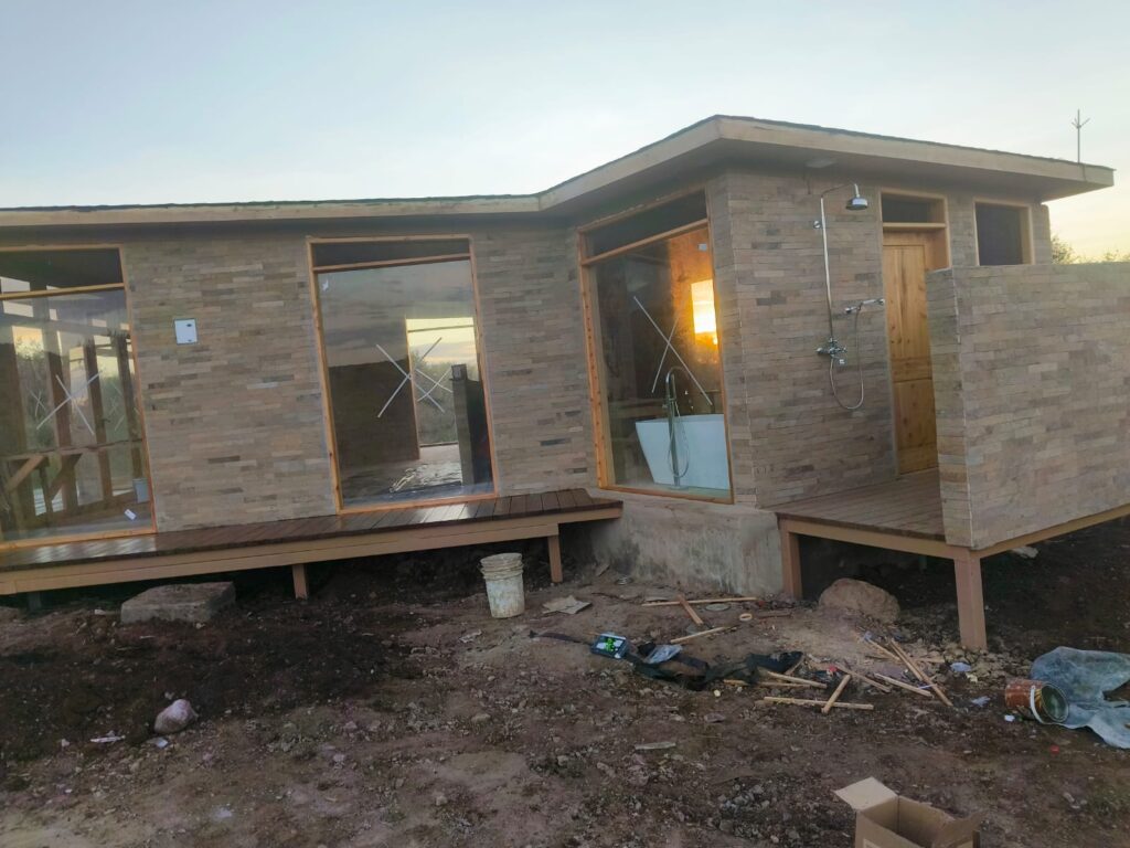 A modern commercial building under construction by LAVINGTON BUILDERS & DESIGNERS COMPANY LTD., showcasing advanced construction techniques and innovative design.