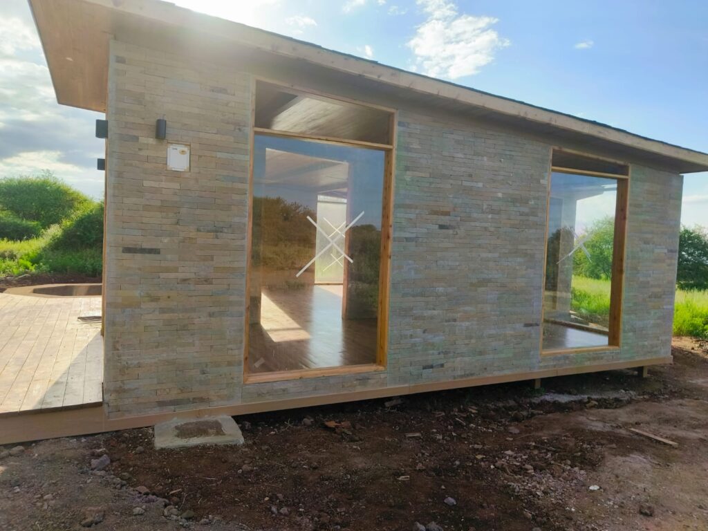 A modern commercial building under construction by LAVINGTON BUILDERS & DESIGNERS COMPANY LTD., showcasing advanced construction techniques and innovative design