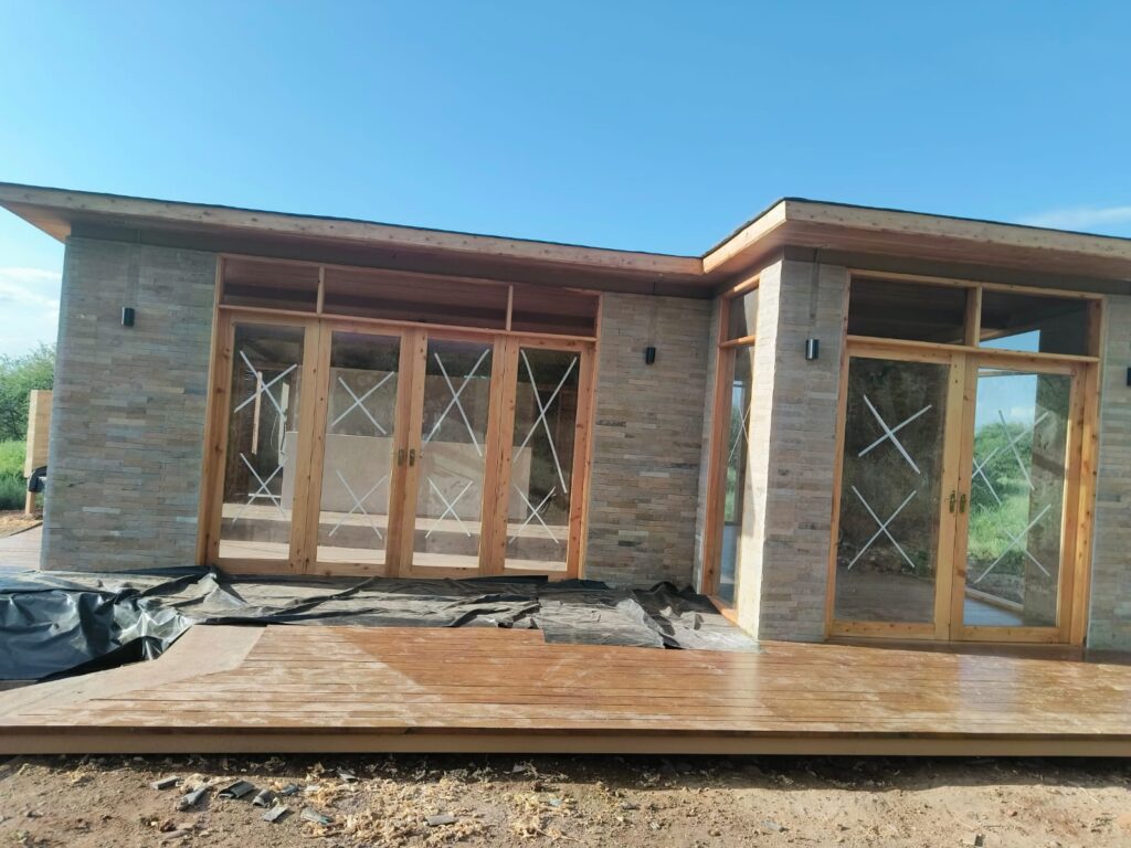 A modern commercial building under construction by LAVINGTON BUILDERS & DESIGNERS COMPANY LTD., showcasing advanced construction techniques and innovative design.